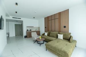 a living room with a couch and a table at Boutique Hotel Nika in Ohrid