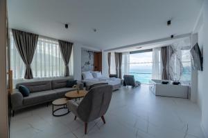 a living room with a couch and a table at Boutique Hotel Nika in Ohrid