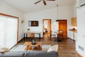 a living room with a couch and a table at Mt Stimson Suite Work-From-Anywhere-Ready in Kalispell