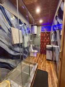 a bathroom with a shower and a toilet in it at Smith Palace Group Of Houseboats in Srinagar +92 photos