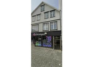 a building with a store on a street at Stavangerliving in Stavanger