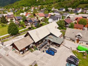 an overhead view of a town with cars parked in a parking lot at Apartma-studio Ajdna in Žirovnica