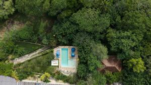 an overhead view of a house in the forest at Rukgala Retreat in Digana