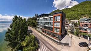 an aerial view of a building next to the water at Boutique Hotel Nika in Ohrid