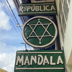 a sign for a maraudian restaurant on the side of a building at República Mandala - Quarto duplo 2 in Ouro Preto