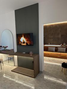 a living room with a fireplace in the wall at L'Incanto Suite - B&B Surano LE in Surano