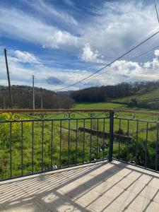 a balcony with a view of a field at Casa dos Ramos in Rio de Fornos