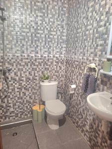 a bathroom with a toilet and a sink at Oasis Menara in Marrakesh +12 photos