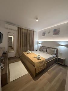 a bedroom with a bed and a television in it at Tropea Home Free Private Parking in Tropea