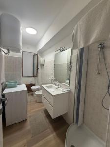 a bathroom with a sink and a toilet at Tropea Home Free Private Parking in Tropea +32 photos