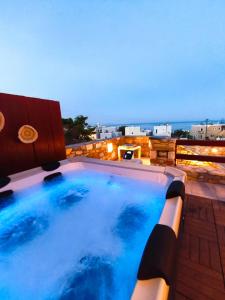 a large swimming pool on top of a building at PetraCasa Luxury Villa in Azolimnos Syros