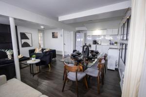 a kitchen and a living room with a table and chairs at Minimal 1bed APT basement with free parking in Yonkers