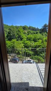 a view of a parking lot from a door at Fuga in Valpolcevera Comfort e Relax in Mignanego