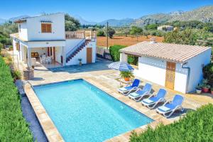 a villa with a swimming pool and a house at Villa Oliver by Villa Plus in El Port