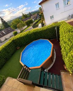 a swimming pool in the yard of a house at Chez Fifi in Surpierre
