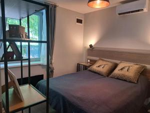 a bedroom with a bed and a window at szemesd6 in Balatonszemes +14 photos