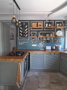 a kitchen with a counter top and a stove at szemesd6 in Balatonszemes