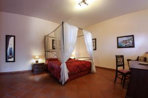 A bed or beds in a room at Grand Hotel Capodimonte