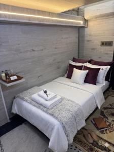 a bedroom with two beds with towels on them at City Mini Hotel in Chişinău