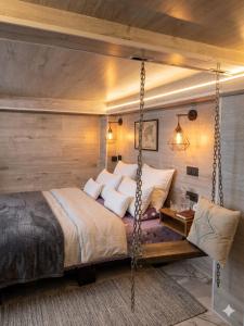 a bedroom with a bed with a swing at City Mini Hotel in Chişinău