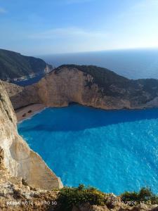 a view of a beach on the side of a cliff at GIATRELOS HOUSE "near the shipwreck Zakynthos" in Volímai +33 photos
