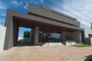 a large building with a large glass door at Mantra Hotel in Feliz Natal