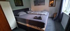 a bed in a small room with at Tiny house im Wingster Forst in Wingst