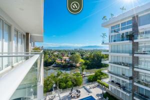 a view from the balcony of a building at 3BR Condo Right Next to the Beach - Pool - Palapa in Nuevo Vallarta
