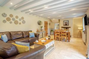 a living room with a couch and a table at 2 Bed in Abergele oc-88974 in Llanfair Talhaiarn