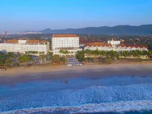 an aerial view of a beach and buildings at Hotel Jequitimar Guaruja Resort & Spa by Accor in Guarujá
