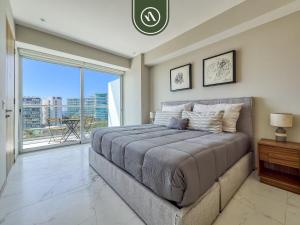 a bedroom with a large bed and a large window at Luxury 3 BR Condo - Beach Access 1 Block Away in Bucerías +61 photos