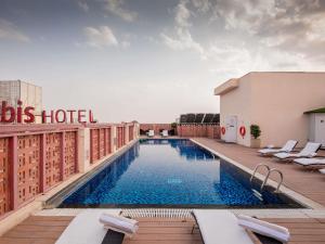 a hotel swimming pool on the roof of a building at ibis Jaipur City Centre - An Accor Brand in Jaipur