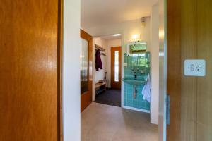 a bathroom with a sink and a mirror at Churfirstenblick in Wildhaus +20 photos
