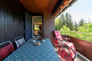 a table on the balcony of a house at Churfirstenblick in Wildhaus
