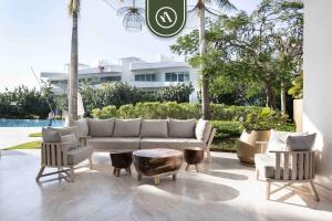 a living room with a couch and two chairs and a table at New 2BR APT - Beach Access - Pool - GYM - Jacuzzi in Nuevo Vallarta