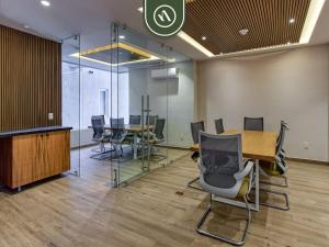 an office with a conference room with a table and chairs at New 1 BR Condo with Amazing Rooftop Pool - Jacuzzi in Bucerías +37 photos