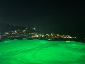 a view of a body of water at night at Corte Degli Ulivi Resort in Vico Equense
