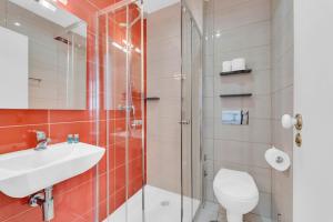 a bathroom with a shower and a sink and a toilet at Old City Guest House in Braga +69 photos