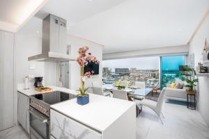 a kitchen and living room with a view of the city at Nautico nautico 8a in Puerto Vallarta