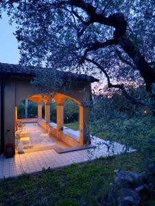 a gazebo with a table and chairs on a patio at Bolsena Cento20 - Rooms & Relax in Bolsena