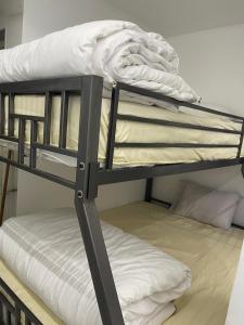 a couple of bunk beds in a room at Luxury king studio in 6th Of October