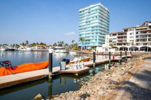 a marina with boats in the water with buildings at Nautico nautico 8a in Puerto Vallarta