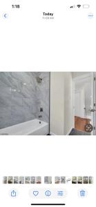 a screenshot of a bathroom with a tub and a sink at The Signature Stay in Clifton