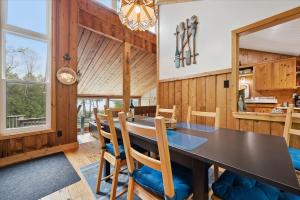 a dining room with a table and chairs at Rustic Waterfront Kayak Near National Park in Tobermory
