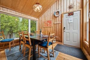 a dining room with a table and chairs at Rustic Waterfront Kayak Near National Park in Tobermory +34 photos