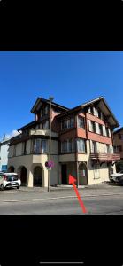 a large building on the corner of a street at Apartment MICKEY in Interlaken