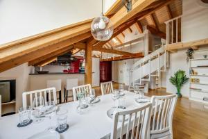 a dining room with a white table and chairs at Apartment in Sankt Moritz in St. Moritz