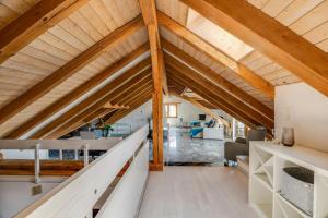 a loft conversion of a house with wooden beams at Apartment in Sankt Moritz in St. Moritz