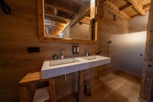 a bathroom with a sink and a refrigerator at Hosteria Pastor in Aranda de Duero +25 photos