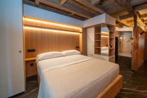 a bedroom with a large white bed in a room at Hosteria Pastor in Aranda de Duero